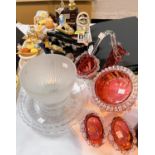 A selection of novelty teapots and a selection of Cranberry and other glassware