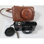 Leica: A Leica D-Lux 3 digital camera in leather carry pouch