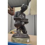 An Art Deco style bronze 'Pandora' kneeling over box on onyx base, ht. 26cm