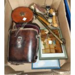 A selection of collectors items:  binoculars; surveyors tape; Don Bradman "Flicker" book;