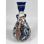 A 19th century Persian Iznik style vase depicting women playing instruments, with small handles to