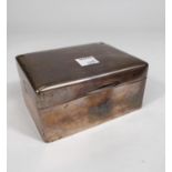 A hallmarked silver cigarette box by Walker and Hall, Sheffield 1931, length 11.5cm