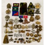 A selection of military badges including Cheshire Regiment etc