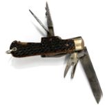 A Victorian multi blade pen knife with horn handle, including cork screw and hanging loop