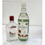 A litre bottle of Bacardi white rum; a 26 and two thirds fluid oz. bottle of Southern Comfort; a