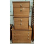 A 1970's teak small 3 height chest of drawers; a pair of matching bedside cabinets