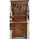 A reproduction mahogany full height bookcase with double glazed cupboard over 2 drawers and double