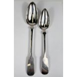 A large near matching pair of 19th century continental white metal basting spoons, one marked for