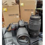 A Nikon D7000 digital SLR camera with a Nikon DX Nokkor AF-S 18-135mm 1:3.5 5.6G ED and s Nikon DX