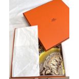 HERMES, Paris, a 100% silk square scarf, blue border with brown and yellow design of soldiers and