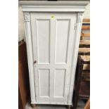 A late 19th century full height pine cupboard enclosed by 4 panel doors, painted white