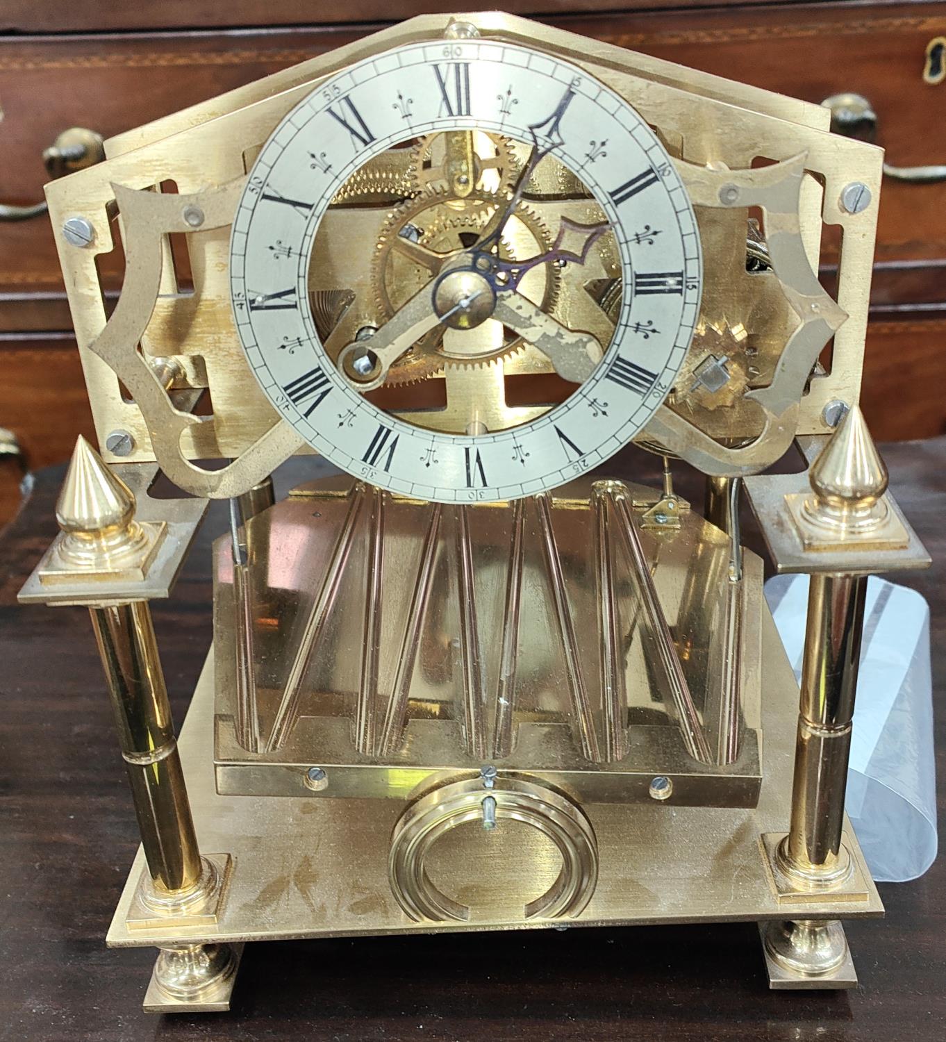 An early 20th century Brass Congreve clock with rolling ball Fusee movement of small proportions