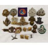 A selection of military cap and other badges including east Yorkshire Regiment etc