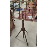 An early 19th century mahogany occasional table with circular top, on turned column and triple