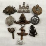A selection of military badges including First Surrey Rifles etc