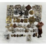 A selection of military badges and buttons including King's Borders Own Scottish Regiment,