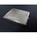 An engine turned cigarette case Birmingham 1933 and 2 hallmarked gold napkin rings 4.5oz