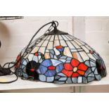 A pendant light fitting with large Tiffany style lead and coloured glass shade, dia. 44cm