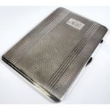 An engine turned hallmarked silver cigarette case, inscribed Birmingham 1955 6oz