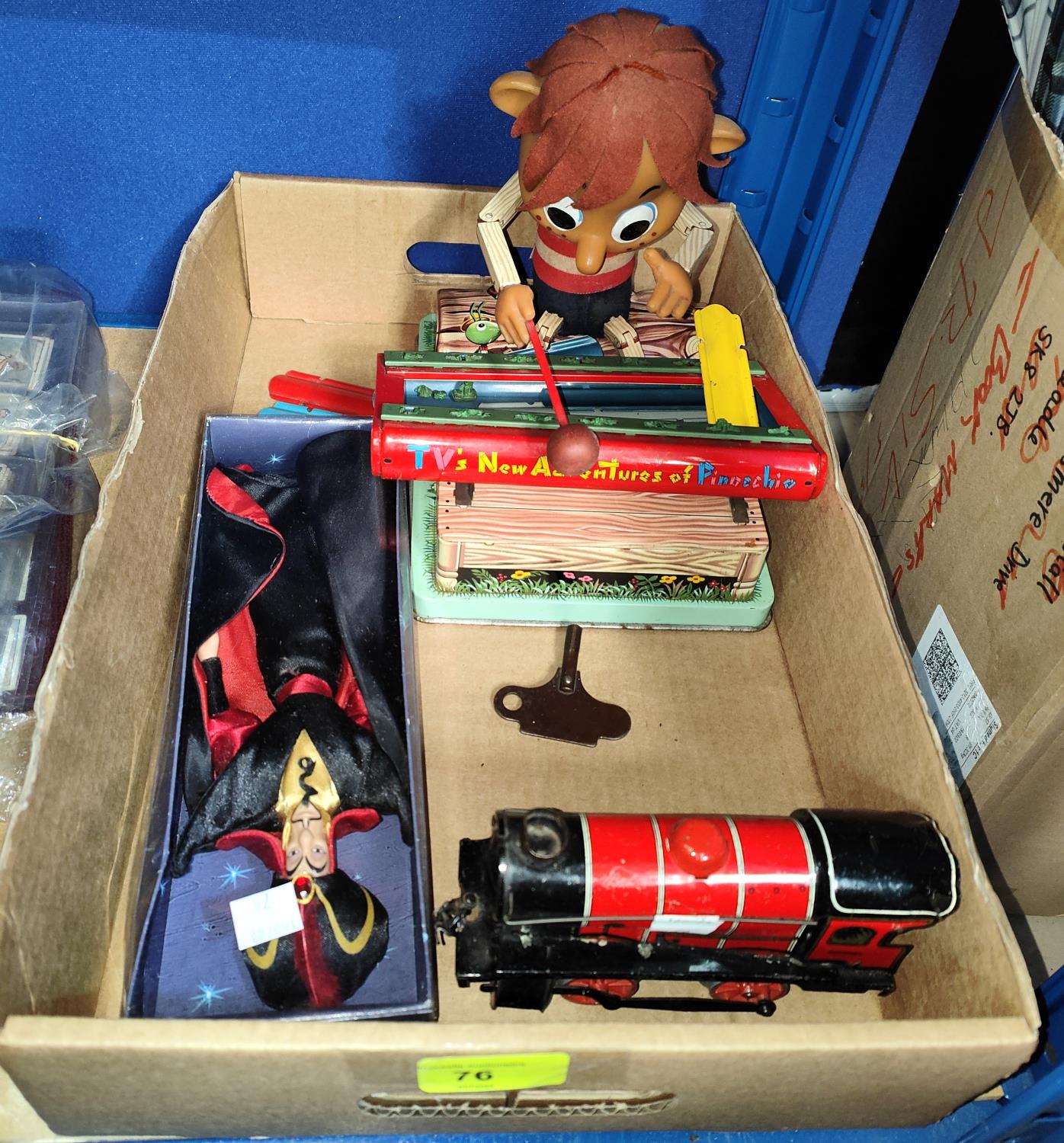 A Hornby tinplate clockwork loco with key; a Pinocchio Xylophone clockwork toy (a.f.); a Disney