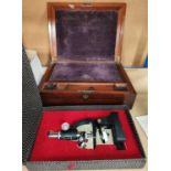 A 19th century figured mahogany lap desk; a boxed "Precision Microscope"