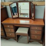 A Stag cherry wood 2 piece bedroom suite comprising wardrobe, dressing table with stool, and bedhead