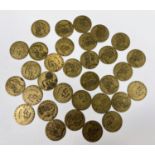 Approximately 30 George III brass guinea tokens