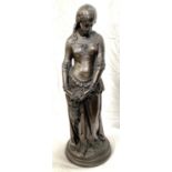 A large bronzed resin figure of a young woman with purse, height 57cm