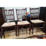 A set of 6 Lancashire spindle back dining chairs with rush seats