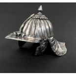 An unusual white metal lobster pot type helmet with finial, length 7.5cm