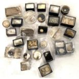 A collection of fossils in small display boxes.