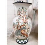 A large modern baluster pottery vase decorated with an exotic bird in tree against white ground, ht.