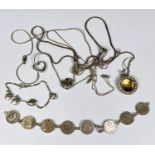 A bracelet formed from 8 x 3d coins, dates 1920's & 1930's (one chain link missing); a chain