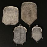 Four white metal chain mail purses, one stamped 'Sterling', 4.6oz
