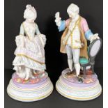 French Porcelain 19th century dressed figure of a male holding a chair; a female lifting