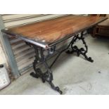 A large 19th century cast metal based pub table with lyre supports