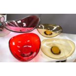 A collection of coloured studio art glass dishes.