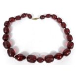 A string of cherry beads with spiral fluted decoration, 50g.