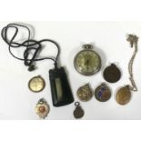 An open faced, keyless pocket watch by Westclox; a gold plated locket; a jade coloured axe shaped