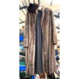 A full length medium brown mink coat; a mink hat