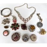 A selection of costume brooches etc. with coloured stone settings.