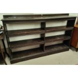 An Edwardian 3 height double bookcase in stained wood, length 164cm, ht 103cm including ledge back