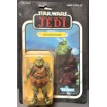 A Kenner Return of the Jedi figure:  Gamorrean Guard, on card in (yellowed) blister pack, 3.75"