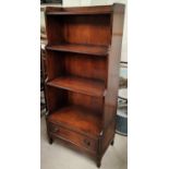 A reproduction mahogany 4 height waterfall bookcase with base drawer