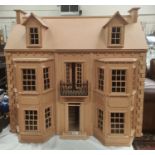 A large modern double fronted 3 floor doll's house, and a comprehensive selection of furniture etc