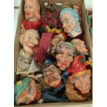 A selection of vintage one wooden headed and various plastic Punch and Judy hand puppetw