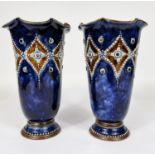 A pair of Royal Doulton tapering pedestal vases with scalloped rims in blue/brown glaze with