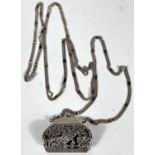 A hallmarked silver novelty marcasite pendant in the form of a purse with triple strand silver