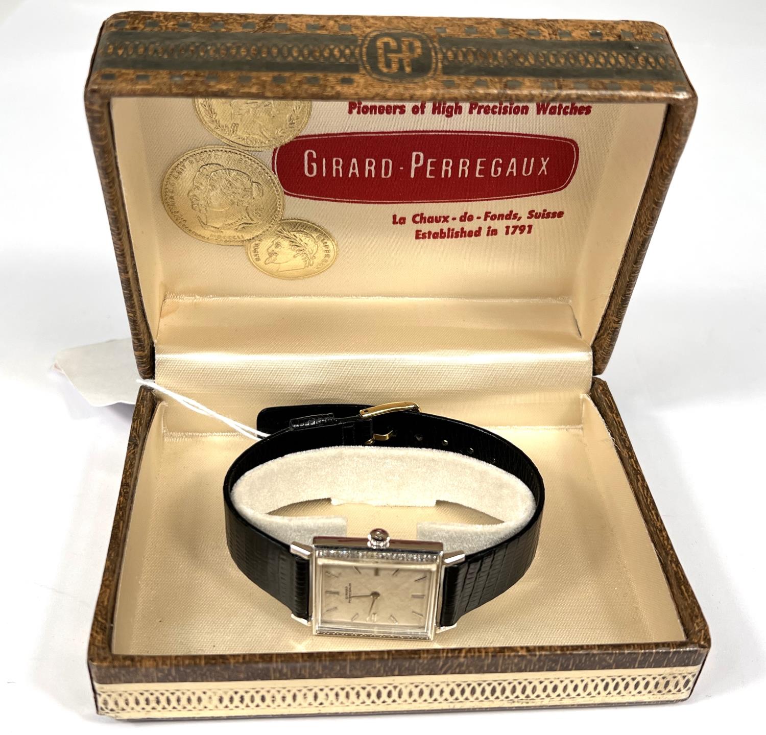 GIRARD PERREGAUX: c. 1970, a white 14ct gold cased rectangular mechanical wrist watch with