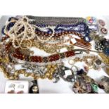 A selection of costume jewellery:  necklaces; brooches; earrings; etc.